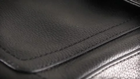 Black leather texture extreme close up with a sliding camera move professiona Stock Footage 159758349