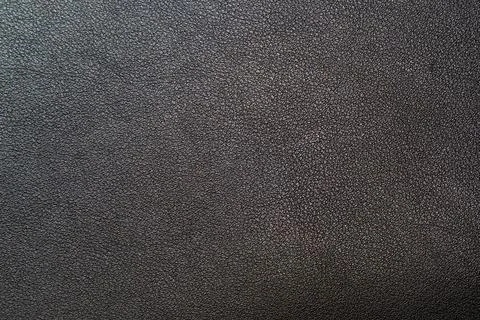 Black leather texture with fine grain, ideal for background designs and creative Stock Photos