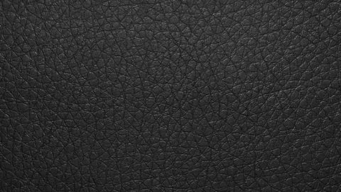 Black leather textured background.Texture-the smooth black leather. Stock Photos