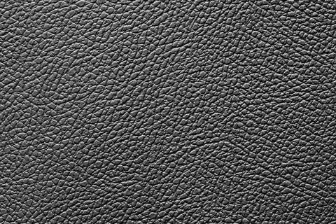 Black leatherette for use as background and other design projects Stock Photos