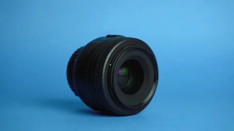 Black lens is on a blue background. Stock Footage 141568113
