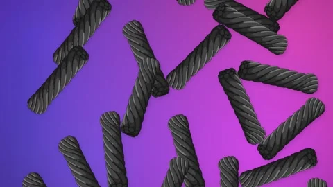 Black Licorice Candy Falling Over Vibrant Purple Stock Footage 345209054