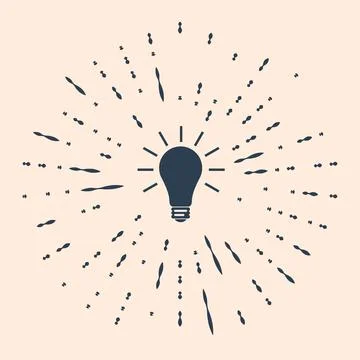 Black Light bulb with rays shine icon isolated on beige background. Energy and Stock Illustration