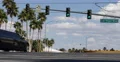 Black Limousine Passing Car Crossing Busy Intersection Las Vegas Strip Boulevard 4k or 4k+ Resolution