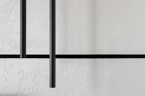 Black linear pendant lights close up Stock Photos