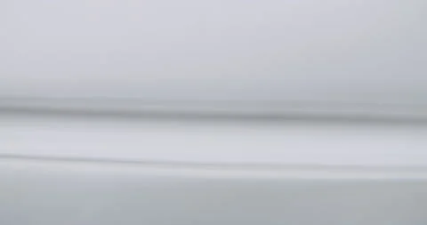 Black liquid dropping onto a mirror creating a reflection Video stock 136437786