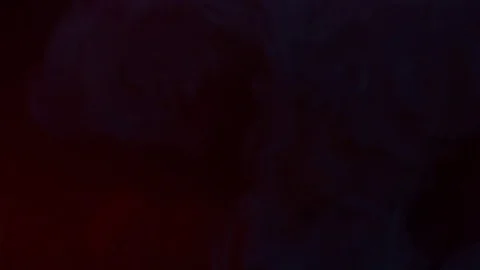 Black liquid falling into red liquid and it mixes Stock Footage 75813817