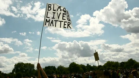 Black Liver Matter flag with cloud and sky in the background Stockbeeldmateriaal 133201129