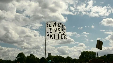 Black Liver Matter flag with cloud and sky in the background Stock Footage 133201178