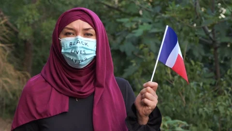 Black Lives Matter (BLM) movement in the France. A Muslim woman in a hijab Stock Footage 135037205