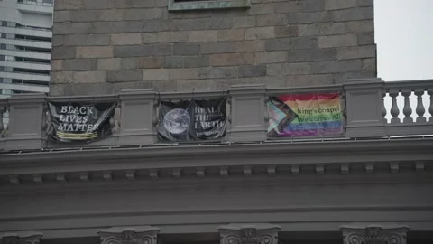 The Black Lives Matter flag and the LGBT flag at King's Chapel in Boston Stock Footage 290925522