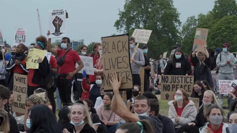 Black Lives matter protesters clapping and chanting and waving placards Stock Footage 131824575