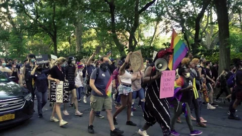 Black Lives Matter Trans and Queer activists march peaceful protest for BLM NYC Stock Footage