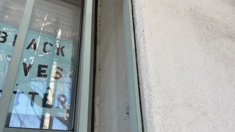 Black Lives Matter in a window Stock Footage 168539404