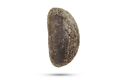 Black loaf of bread on a white isolated background. A loaf of black fresh bread Stock Photos
