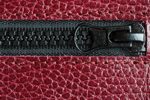 Black lock with lightning on a red textural background Stock Photos