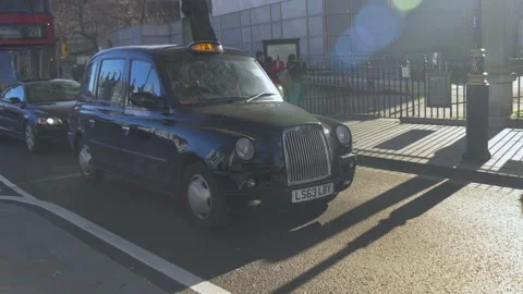 A Black London Cab Passes By Stock Footage 145145694
