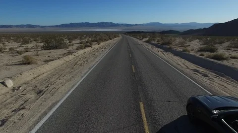 Black Luxury Car in high desert Stock Footage 106969117
