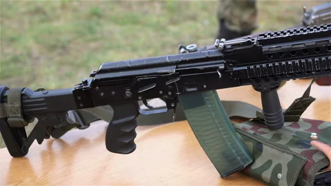 Black machine gun on the table. Video stock 88238516