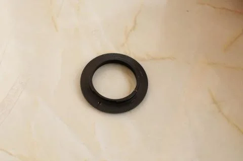 Black macro reverse ring for camera lens Stock Photos