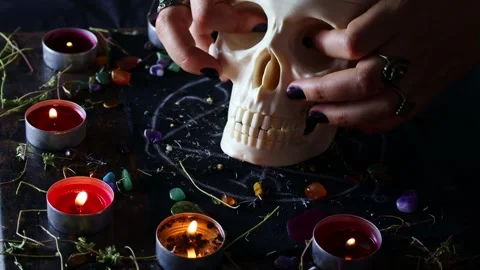 Black magic ritual background with magical altar, skull, candles, crystals Video stock 243094202