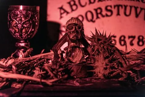 Black magic session and pagan rites with dramatic lighting. Stock Photos