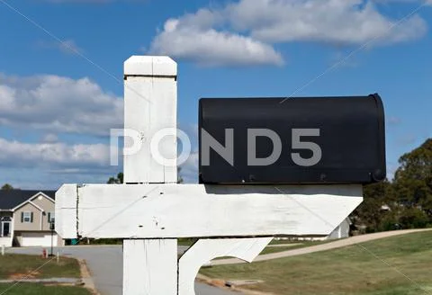 Black mailbox and sky Stock Photos