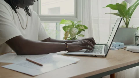 Black Male Developer Coding on Laptop at Desk Indoors Stock Footage 300826356