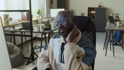 Black Male Developer Working on Computer in Office and Massaging Sore Neck Stock Footage 293122251