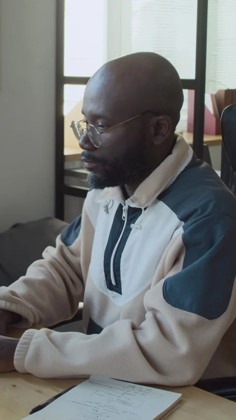 Black Male Developer Working on New Computer Program in Office Stock Footage 293929753