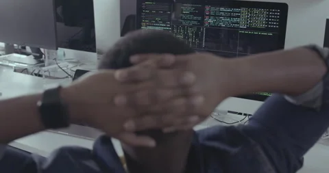 Black Male Engineer Looking at Code in Office with Computer being Hacked Stock Footage 240228363
