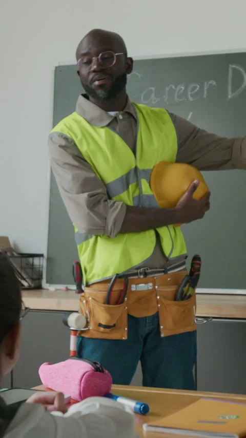 Black Male Engineer Talking to Children at School Career Day Stock Footage 283073038