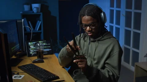Black Male Hacker Assembling Wi Fi Card while Testing Network at Home Office Stock Footage 328250374
