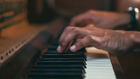 black hands playing piano