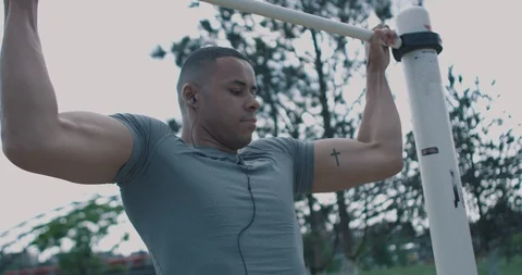 Black Male looking into Camera after doing pull up Video stock 85489153