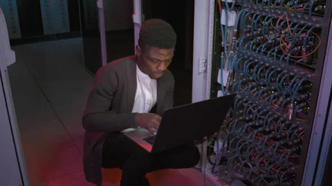 Black Male Network Engineer Working in Data Center Stock Footage 155247388