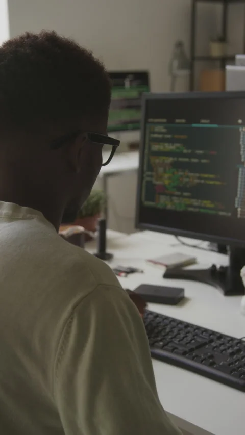 Black Male Programmer Coding on Computer in Office Stock Footage 255992581
