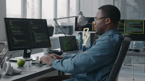 Black Male Programmer Coding on Computer in Office Stock Footage 276202911