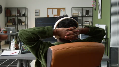 Black Male Programmer Relaxing while Watching Vibe Coding Agent Writing Script 스톡 동영상 335940077