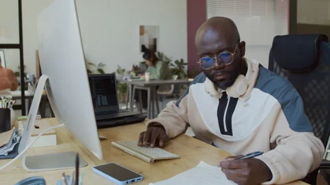 Black Male Programmer Testing Software Algorithm on Desktop Computer Video stock 293171291