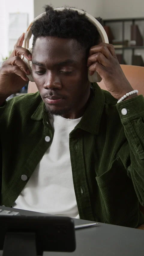 Black Male Programmer Turning on Favorite Music for Relaxing Break at Desk Video stock 335941768