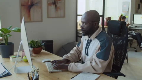 Black Male Programmer Working on Computer in Corporate Office Stock Footage 293121872