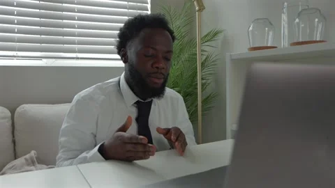 Black Male Remote Worker In Tense Video Call At Home Office Stock Footage 320701782