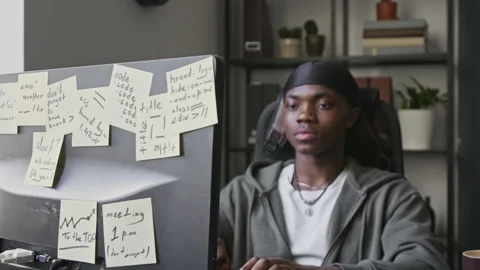 Black Male Software Developer Coding on Computer in Office 動画素材 336712985