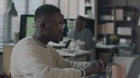 Black Male Software Developer Working in Office Stock Footage 259153020
