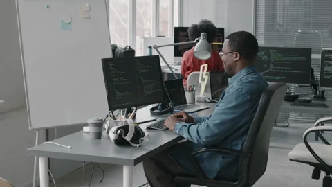 Black Male Software Engineer Program Coding on Desktop Computer in Office Stock Footage 276204528