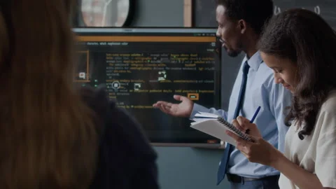 Black Male Teacher Giving Programming Lesson to Class Stock Footage 284429675