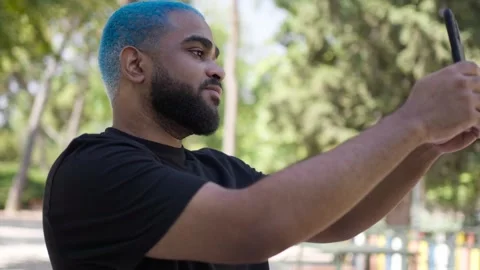 Black man african american  using smartphone to take selfie Stock Footage 287487493