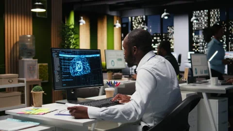 Black man analyst uses AI neural networks for data mining and optimization Stock Footage 318497158