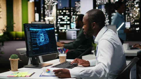 Black man analyst uses AI neural networks for data mining and optimization Video stock 318562840